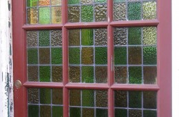 Damaged stained glass door panels restored