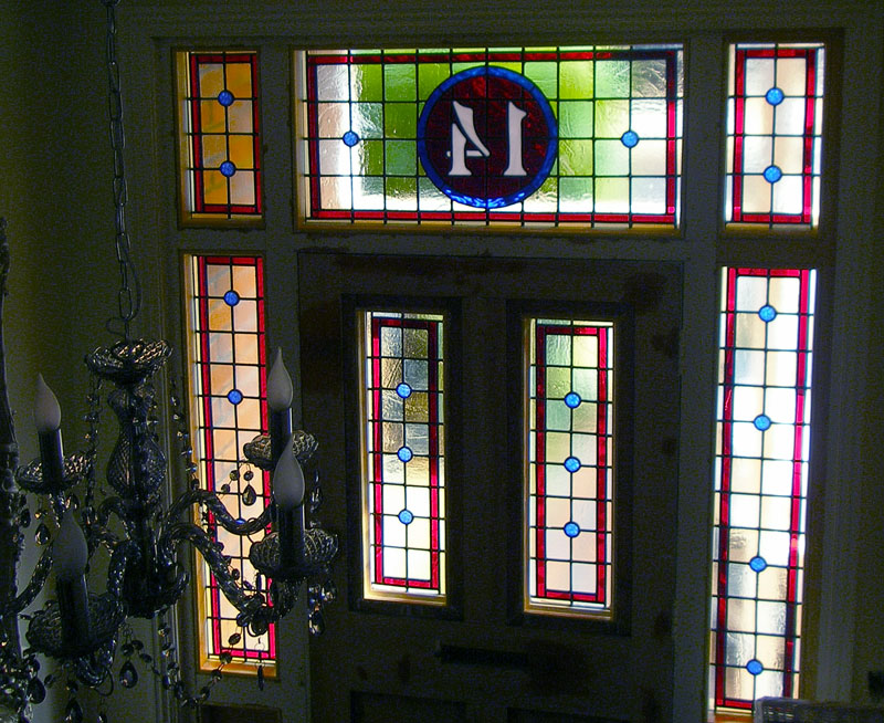 front door and side panels in new stained glass including house number detail